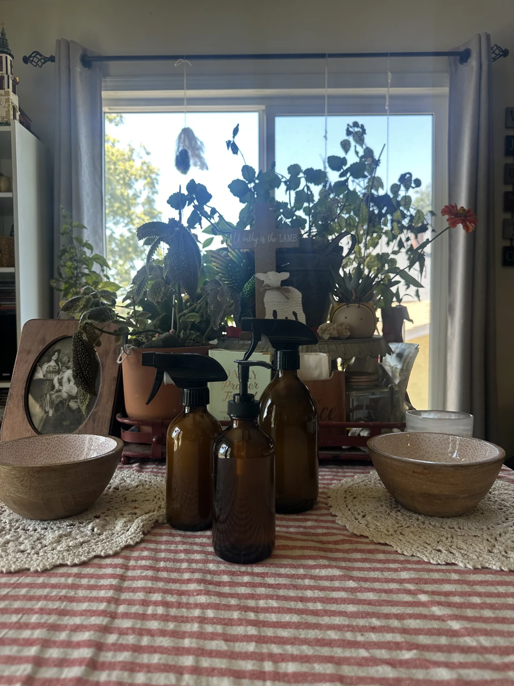 Filth Off and Sudsy and Blessed products displayed together in amber spray and pump bottles